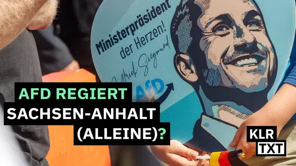 Ein herzförmiges Schild mit dem Gesicht von Ulrich Siegmund und dem Satz "Ministerpräsident der Herzen".